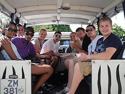 Photograph: Students from the Washburn Law summer study abroad program on a land rover preparing for a field trip.