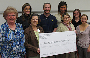 Photograph: Washburn Law GLSA members presenting donation to Lawrence/Topeka PFLAG representatives.