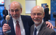 Photograph: Professors Michael Kaye and Myrl Duncan with bobblehead.