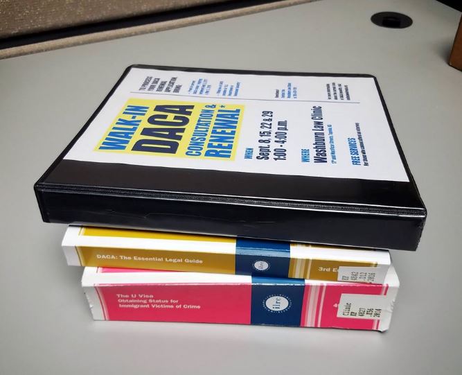 Pile of DACA clinic training manuals. 