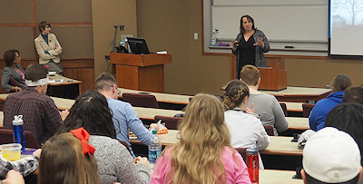 Photograph: Professor Andrea Boyack speaking at housing segregation lunch and learn.