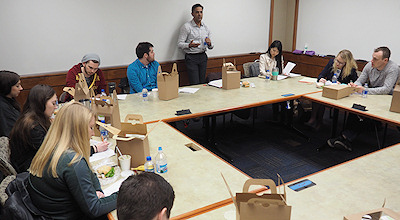 Photograph: Adeel Syed discussing a subordination agreement with Washburn Law students.