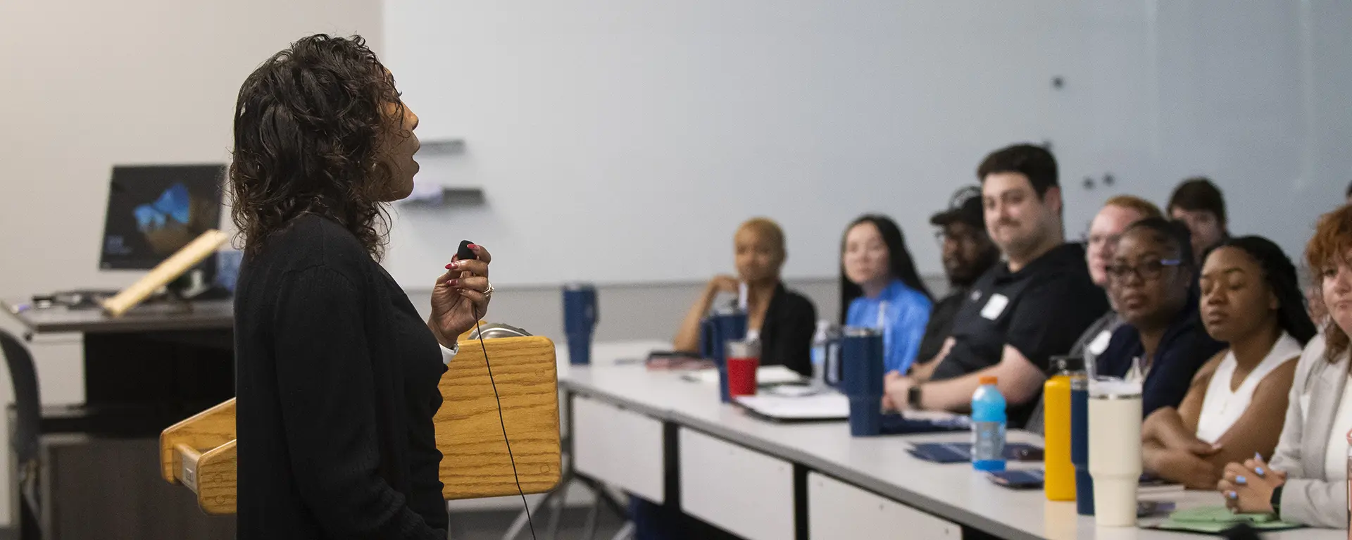 Students listen to faculty at orientation.