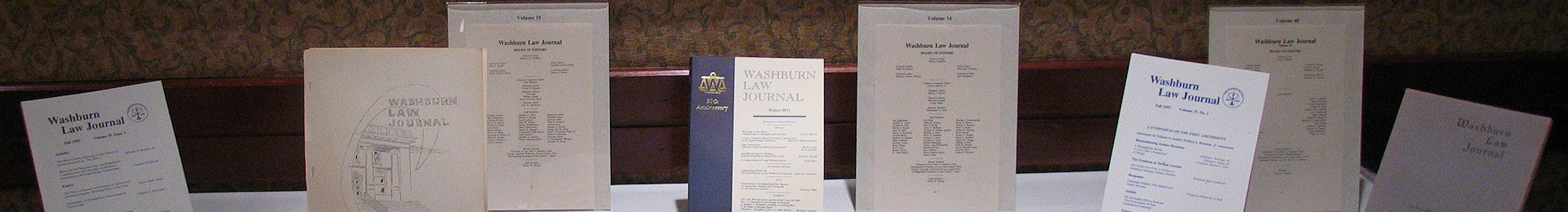 Photograph: Covers of various volumes of Washburn Law Journal volumes.