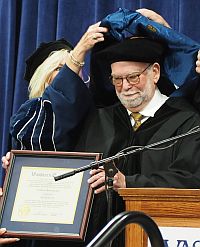 Photograph: Pedro Irigonegaray receiving honorary doctorate of law degree at May 15, 2021 Washburn Law commencement.
