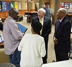 Photograph: Delano Lewis visits with Dean Romig, students and friends
