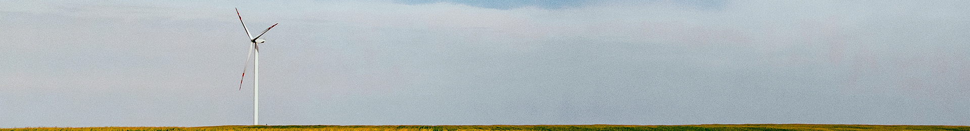 Photograph: Wind turbine in a field.