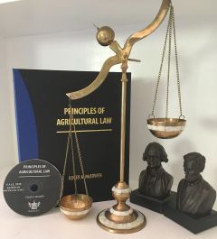 Photograph: Print cover and CD version of Principles of Agricultural Law.