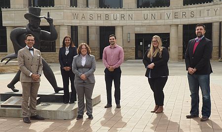 Photograph: Freddy Sourgens with Washburn Law students who developed carbon emissions proposals briefs.